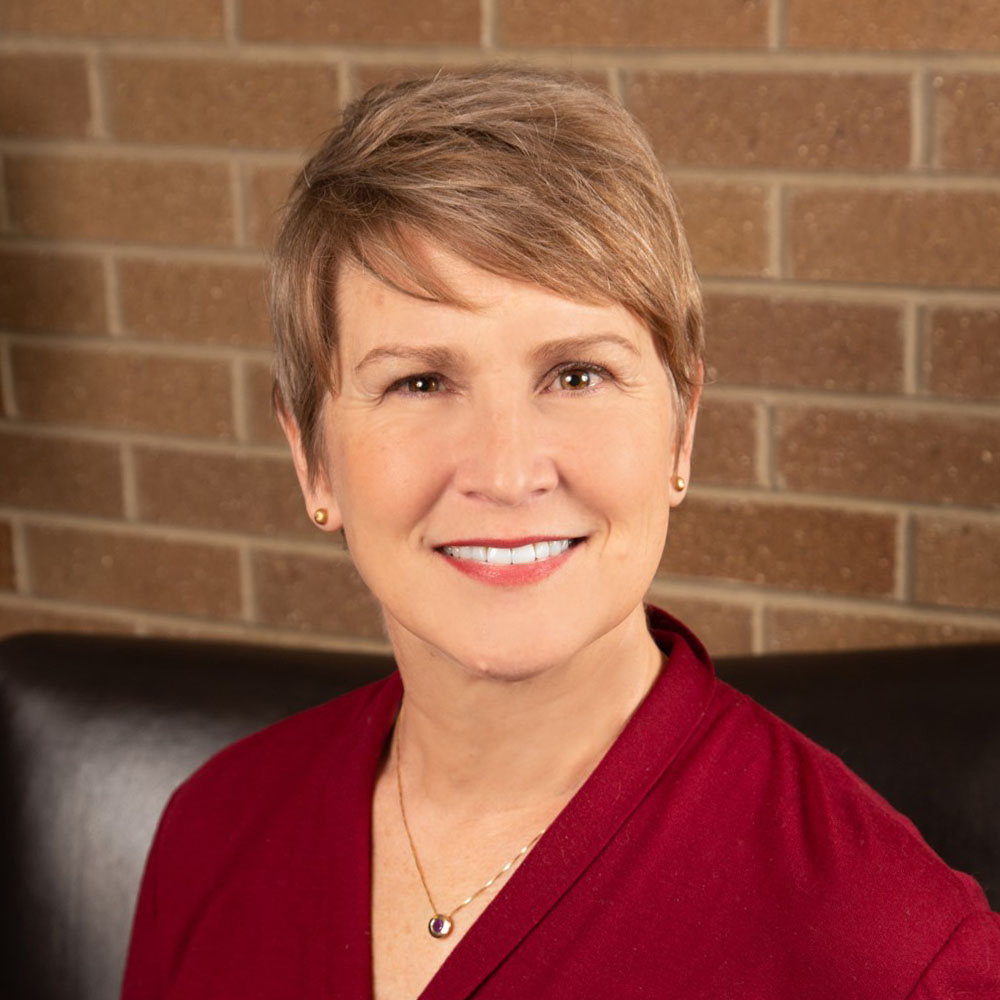 A person smiling for the camera.