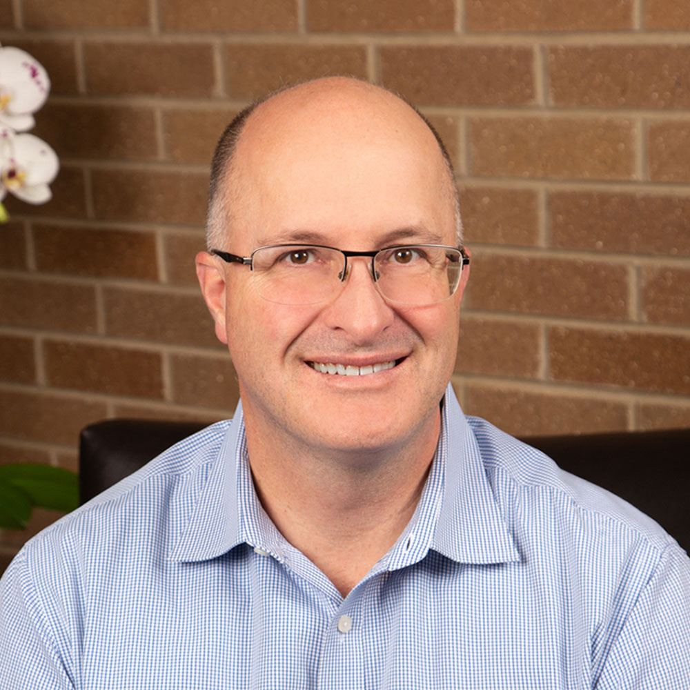 A man wearing glasses.