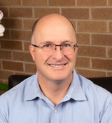 A man wearing glasses.