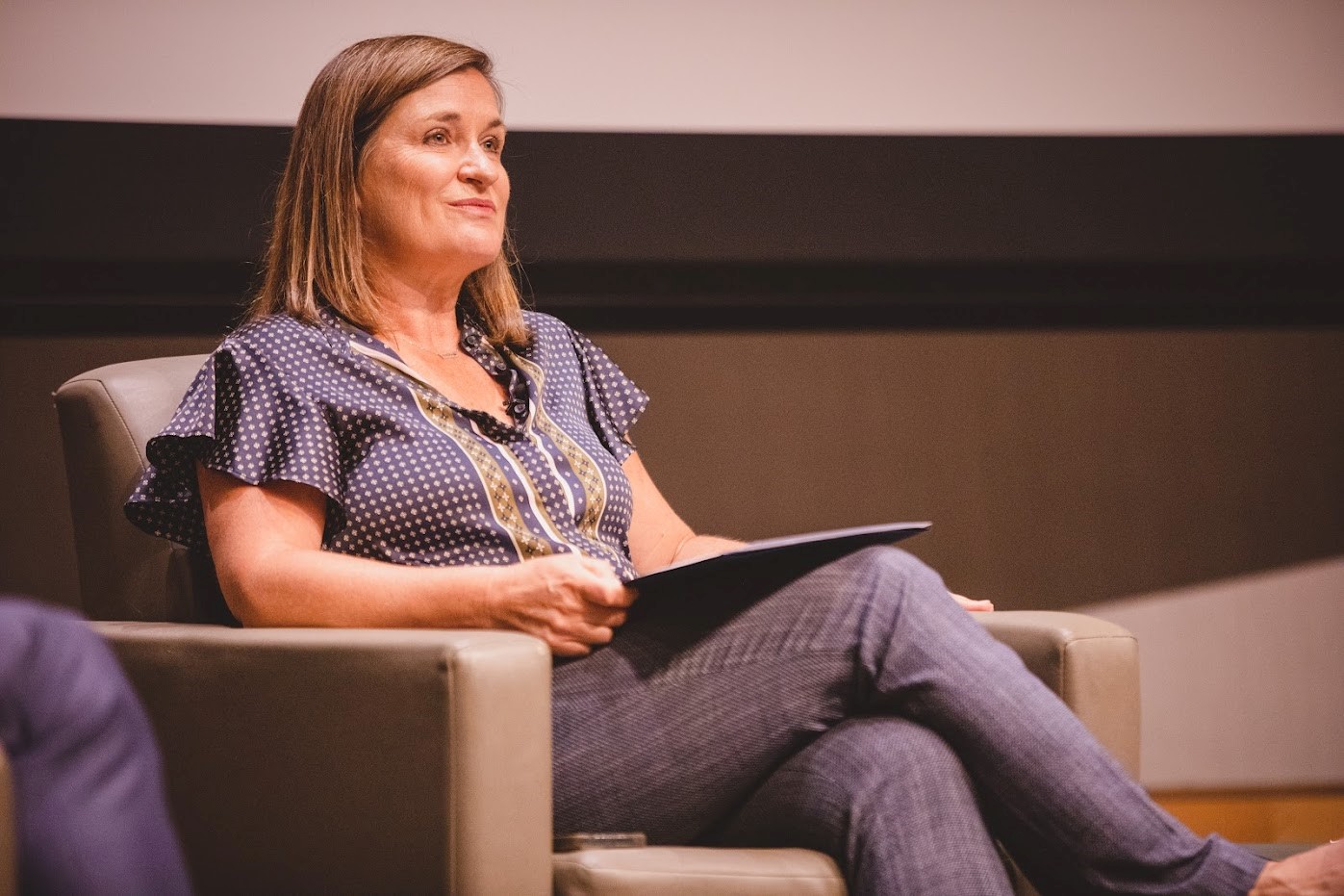 Jenny Wilson sitting on a chair.