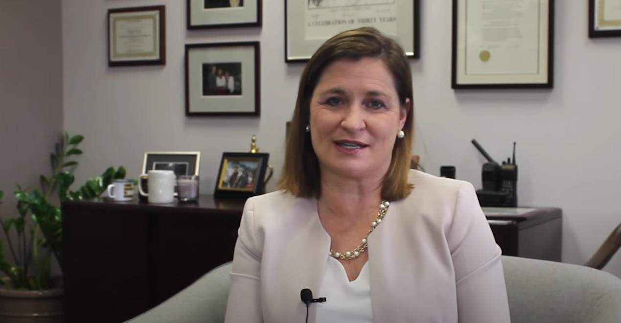 Jenny Wilson sitting in a chair.