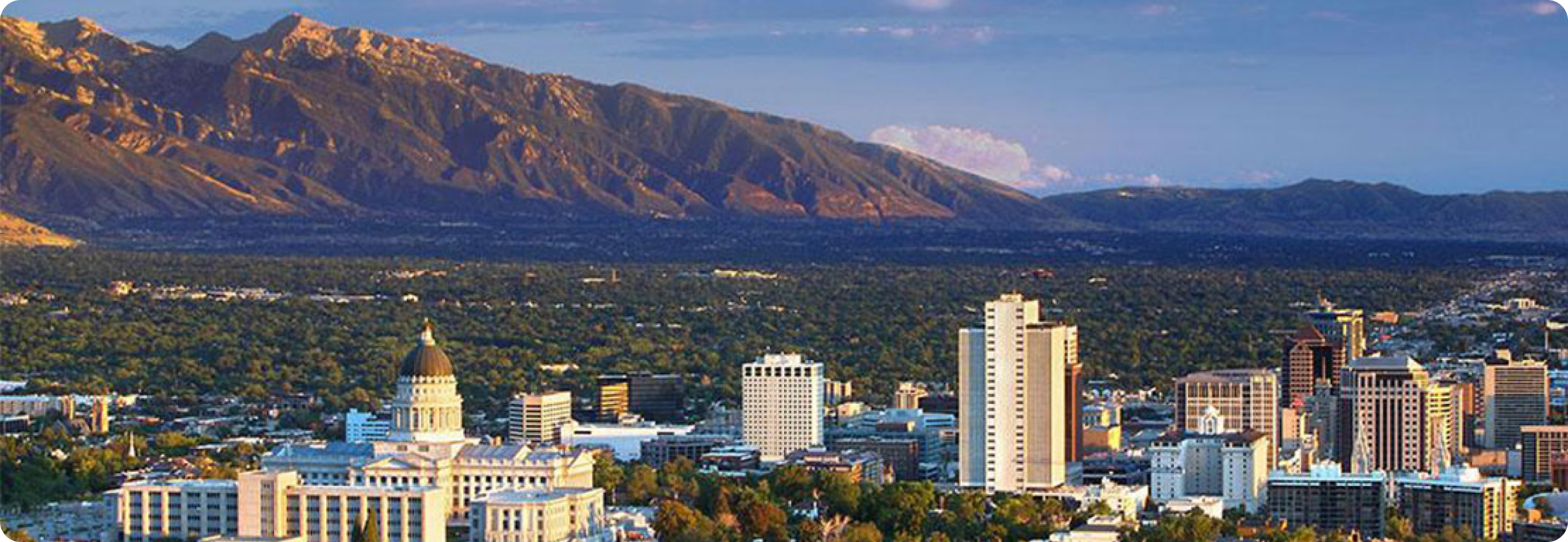 A city with mountains in the background.
