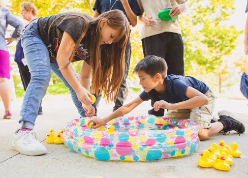 A person and a boy painting.