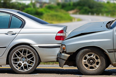 A silver car next to a silver car.