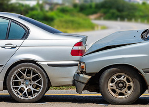 A silver car next to a silver car.