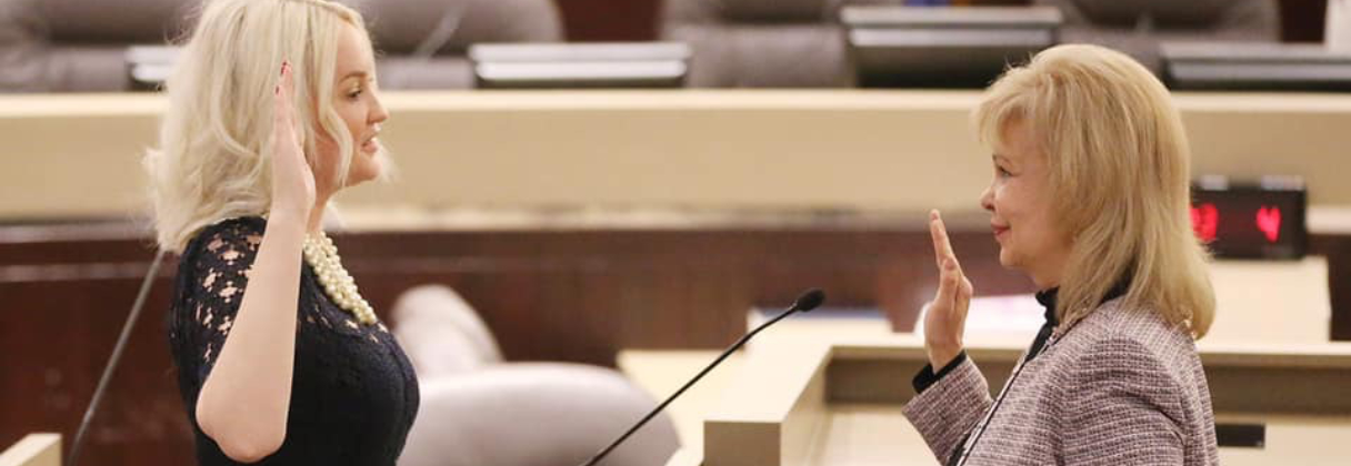 A woman talking to another woman.