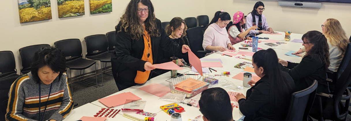 A group of people sitting around a table.