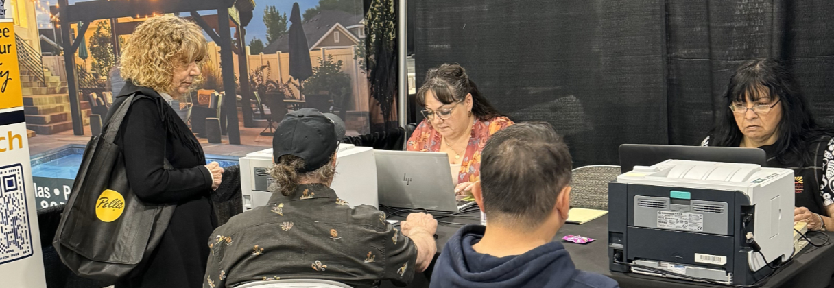 Dana Marie Bell et al. sitting at a table with laptops.