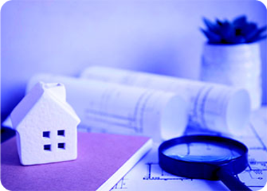 A white and blue cube on a table.