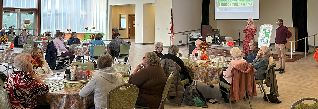 A group of people sitting in a room.