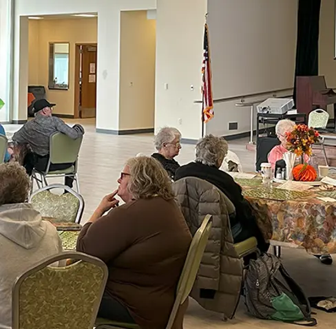 A group of people sitting in a room.
