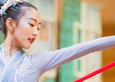 A person holding a red and white pole.