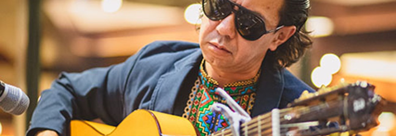 A man playing a guitar.