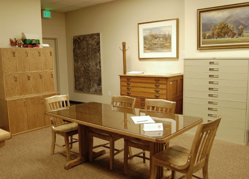 A room with a table and chairs.