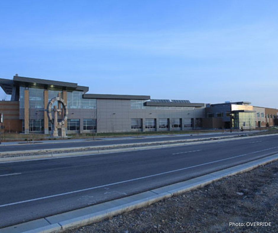 A road with a building along it.