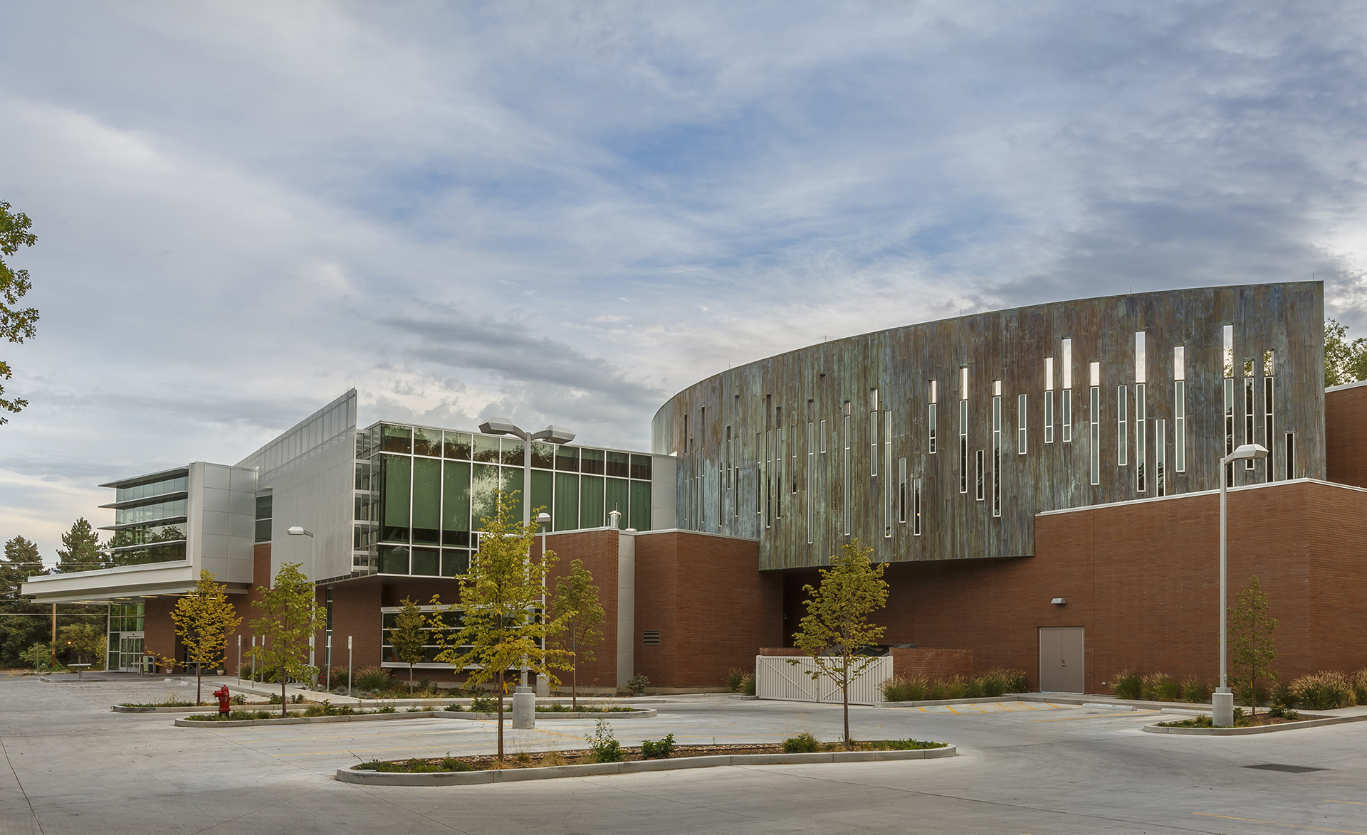 A large building with a parking lot.