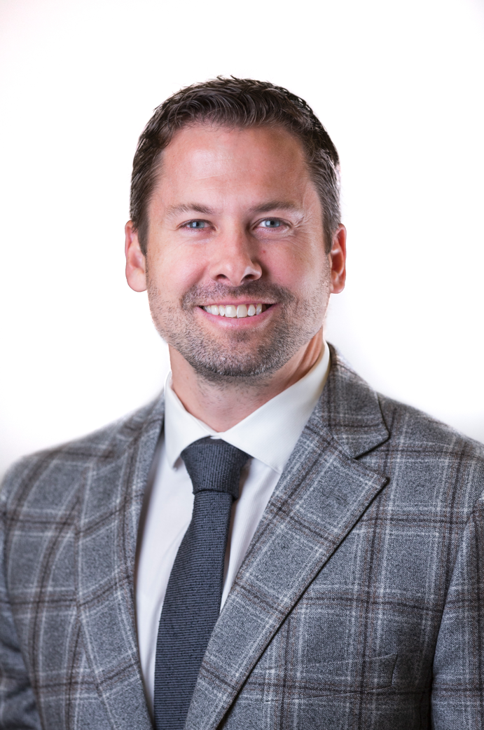 A man wearing a suit and tie.