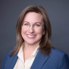 A woman wearing glasses.