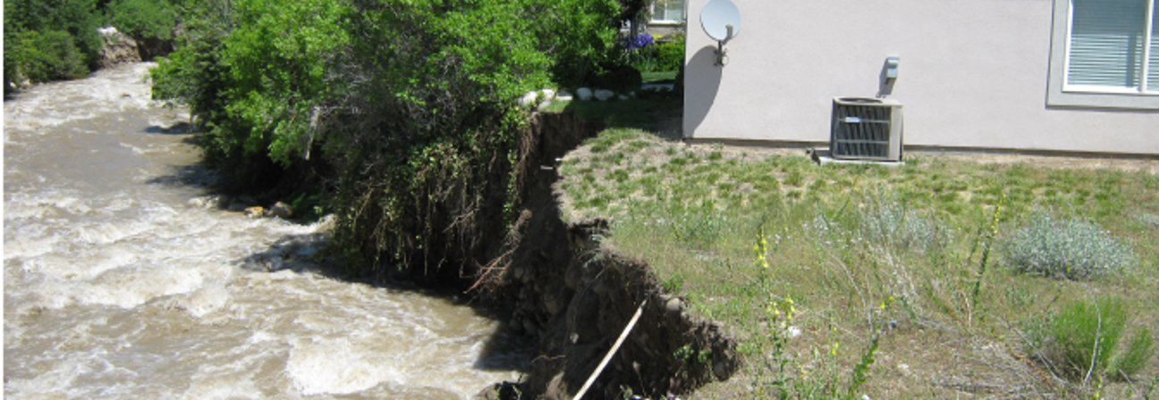 Eroded streambank caused by flooding.