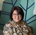 A woman smiling for the camera.