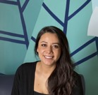 A woman smiling for the camera.