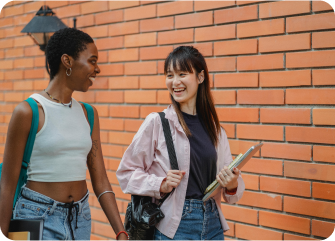 A couple of women looking at a paper.