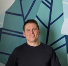 A man smiling for the camera.