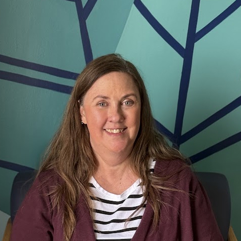 A person smiling for the camera.