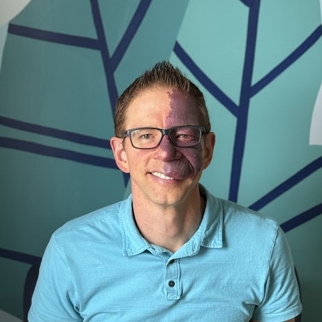 A man wearing glasses.