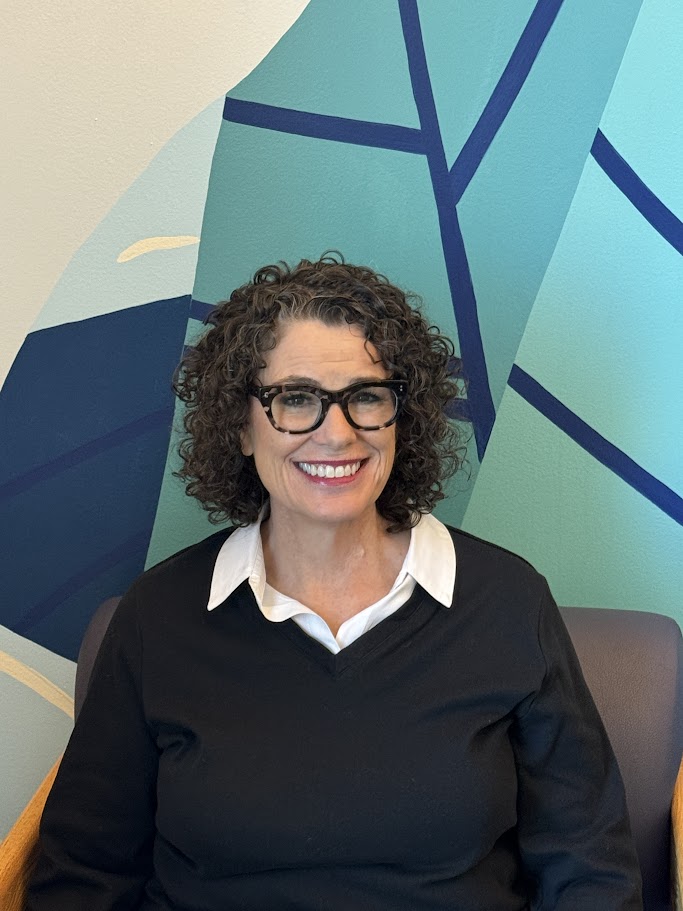 A person wearing glasses.