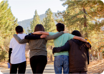 A group of people embracing.