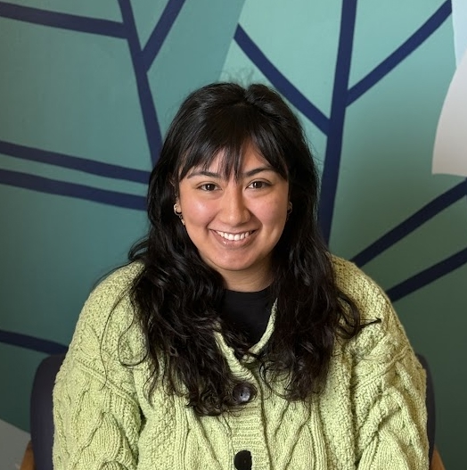 A woman smiling for the camera.