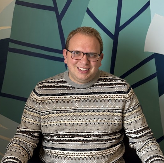 A man wearing glasses.