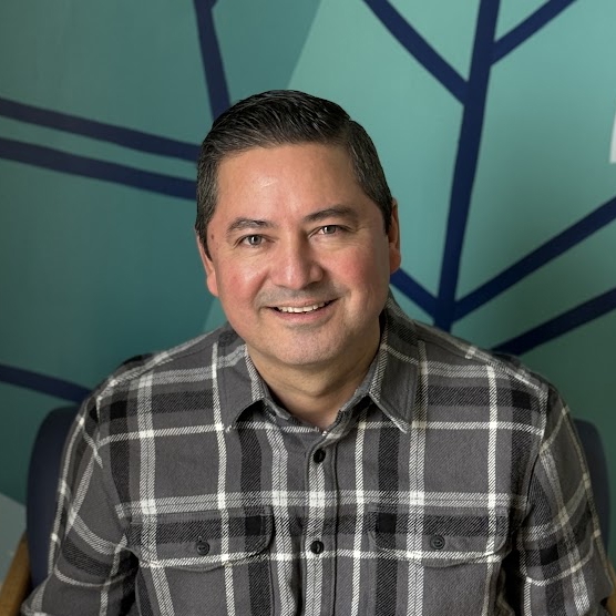 A man smiling for the camera.