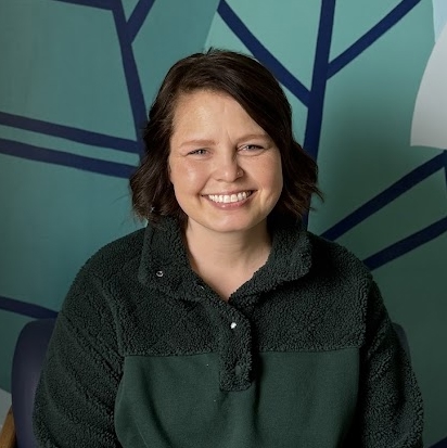 A woman smiling for the camera.