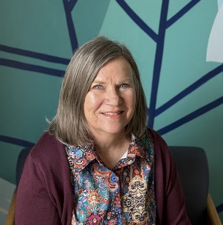 A woman smiling for the camera.