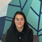 A woman wearing glasses.