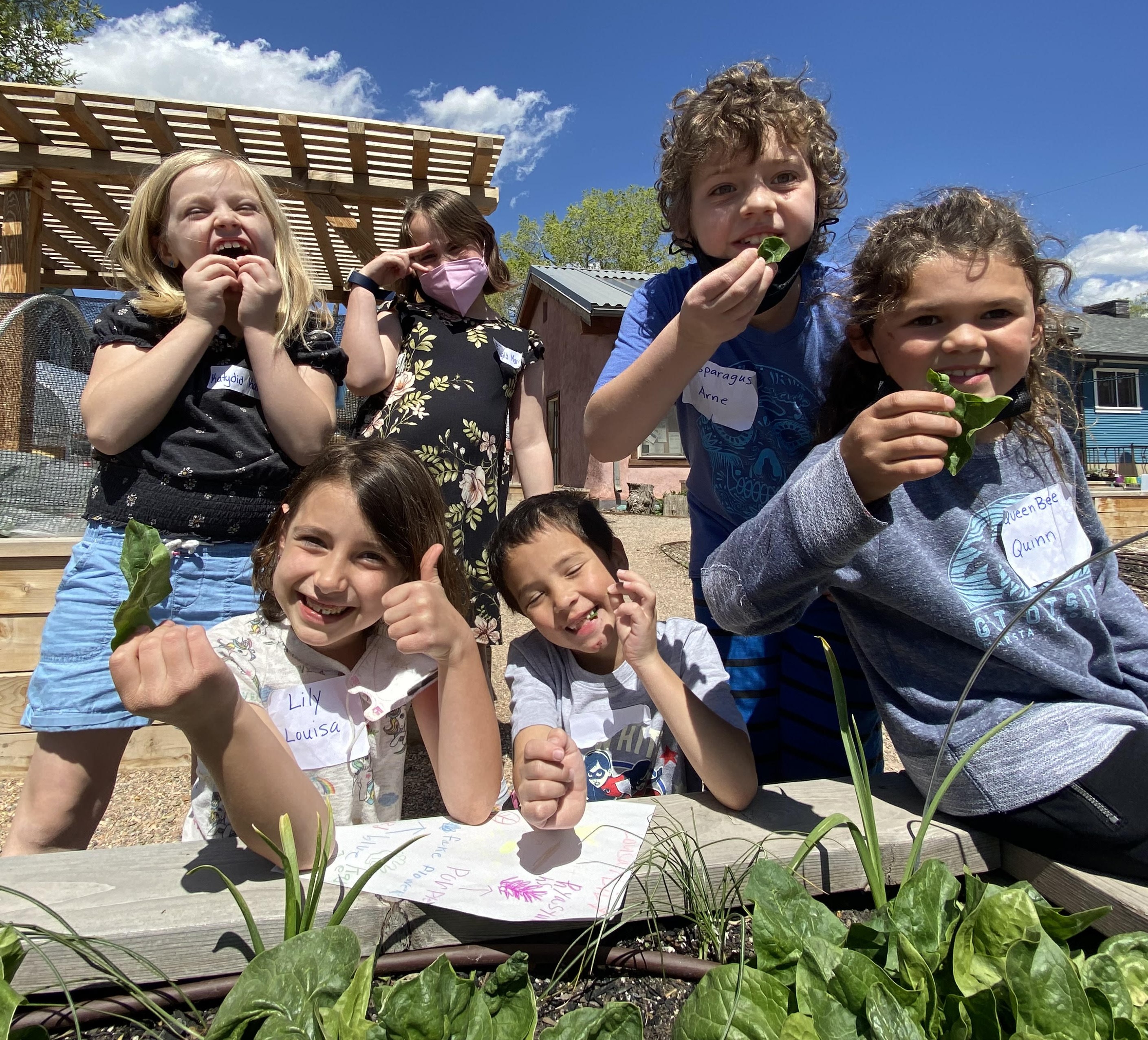 A group of kids eating food.