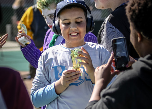 A man holding a cup of ice cream.