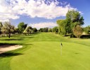A golf course with a flag.