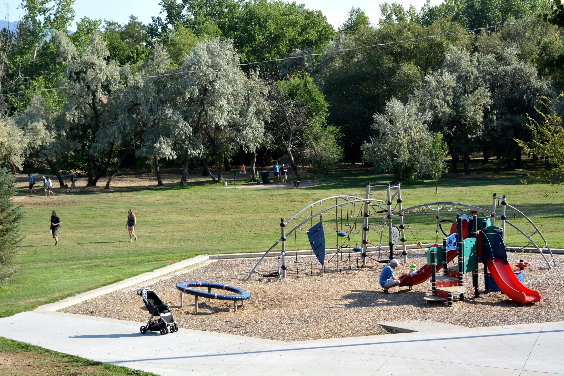 A group of people playing on a playground.