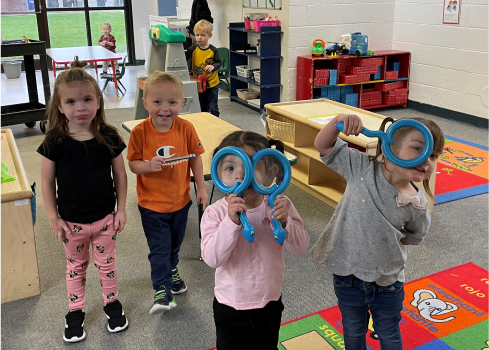 A group of children in a room.